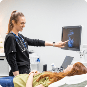 A nurse and a patient doing an ultrasound