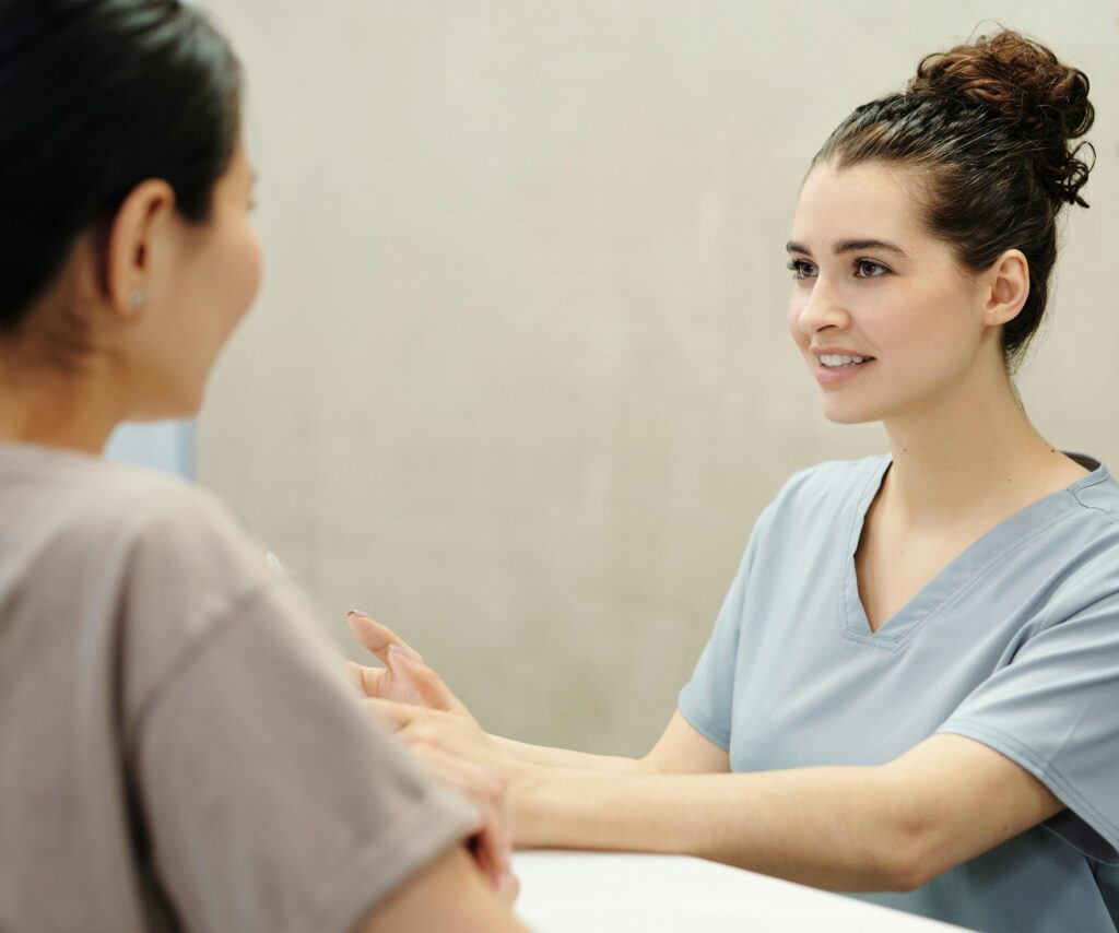A nurse supporting a patient